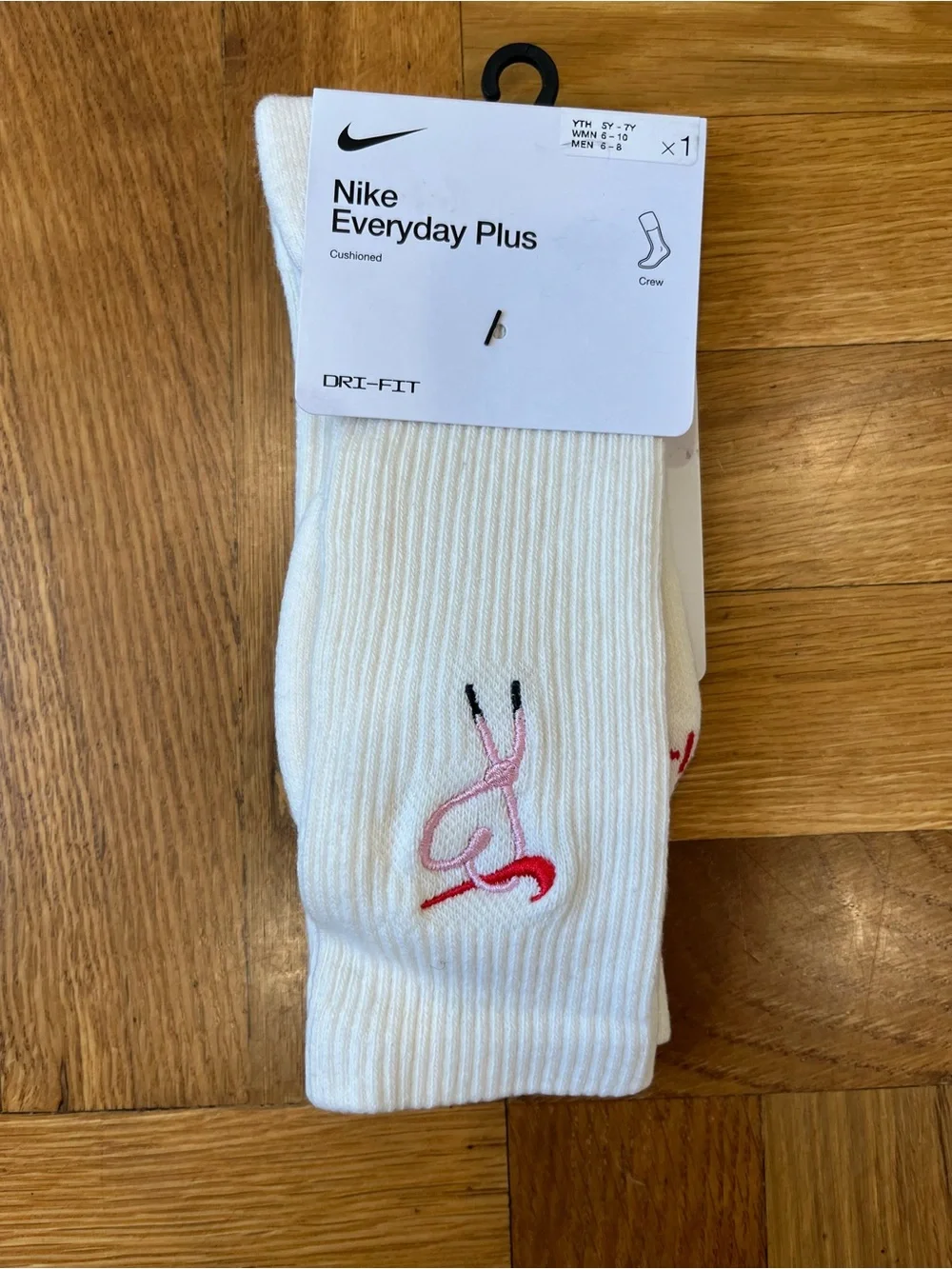 Nike White Crew Socks with Pink and Red Swoosh Accent